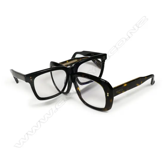 Two pairs of men's designer glasses: Gucci and Dita,